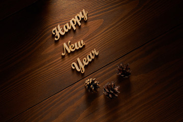Happy New Year!/Happy New Year! - A phrase with wooden letters on a wooden backg