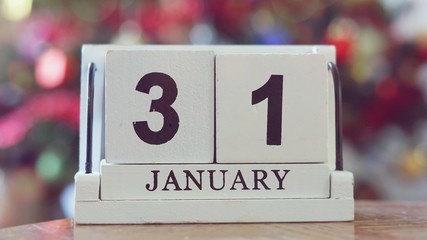 JANUARY 31 CALENDAR DAY on wooden cube calendar on blur colorful