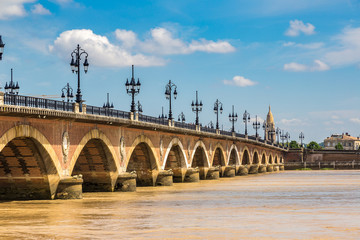 Fototapeta na wymiar Old stony bridge in Bordeaux