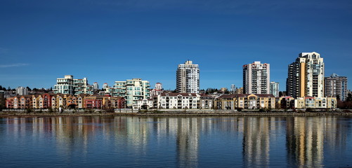 Fototapeta na wymiar Apartment Buildings on the waterfront of New Westminster Downtown