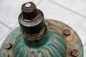 Green fire hydrant at the street corner