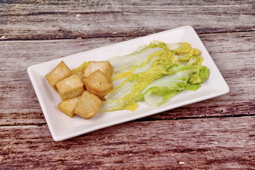 Spicy mixed vegetable salad with sliced Thai white pork sausage