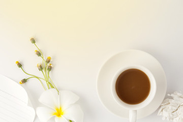 coffee with flower on white office table.