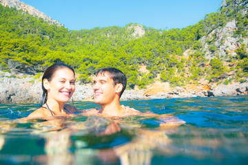 Young Couple Swimming