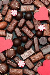 Candies background with red hearts and lollipops