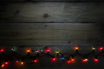 christmas light background, colorful light on dark wood