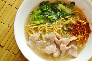 crispy fried yellow noodle with marinated pork and Chinese kale in gravy sauce