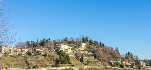 Obraz premium View of the hills that surround Bergamo during a day with clear blue sky, Orobie area, Lombardy, Italy