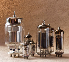composition of different electronic vacuum tubes on kraft paper background.