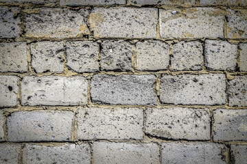 Wall made of big rough concrete blocks as a background.