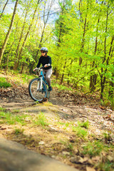 Fototapeta na wymiar Young Woman Riding Her Mountain Bike