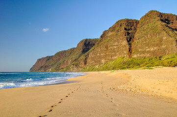 Stunning view of Polihale Beach State Park in the western part of the island of Kauai, Hawaii, USA. In the background you can see the southern end of the Na Pali Coast mountain range. No people.