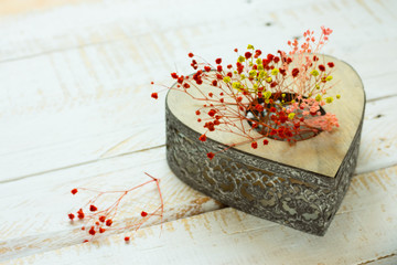 Vintage heart shaped candle holder with colorful delicate flowers on white plank wood backgrounds,Valentine,mother's day