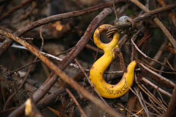iron hook in a pile of garbage