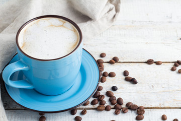 coffee in a blue mug on a white background closeup