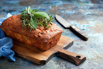 Savoury loaf cake with cheese, peppers and chicken ham, selective focus