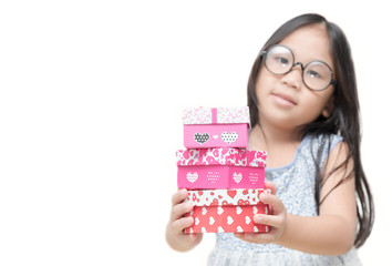 cute little girl holding small red present box gifts in hands isolated on white background