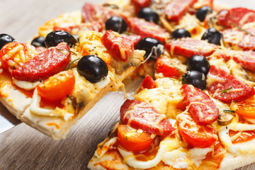 Taking slice of pizza