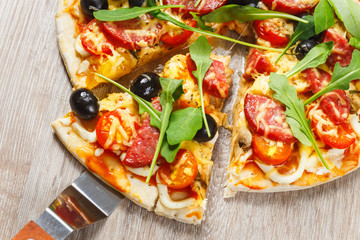 Taking slice of pizza