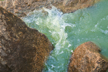 Waves breaking on rocks