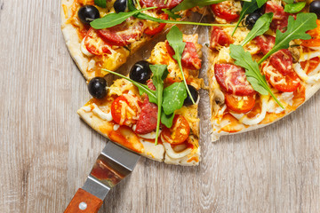 Taking slice of pizza