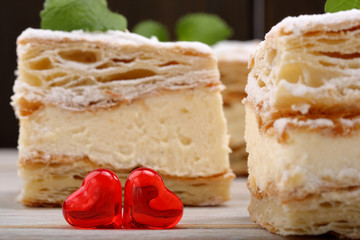 Delicious cream puff pastry with two red hearts