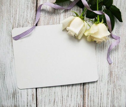 White roses with greeting card