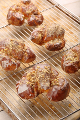Fresh croissants out of the oven and decorated with icing and wa