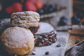 Mix flavour of scone biscuit decorate with chocolate chip and fresh strawberry and blueberry