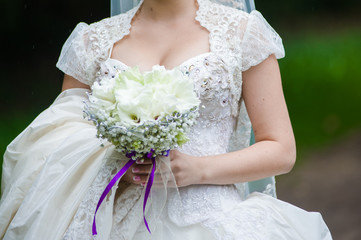 Beautiful bride with bouquet before wedding ceremony