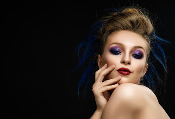 Woman with bright make-up and colourful hairstyle with expressiv