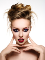 Woman with bright make-up and colourful hairstyle with expressiv