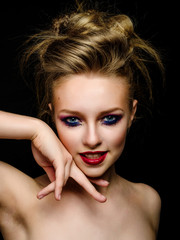 Woman with bright make-up and colourful hairstyle with expressiv