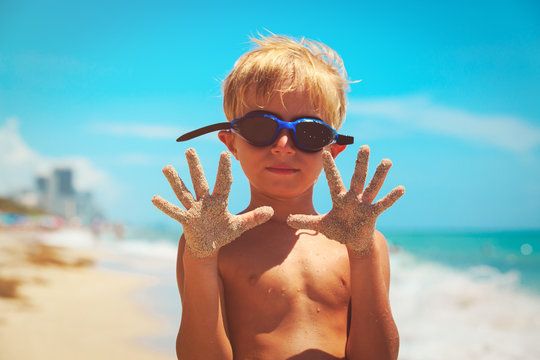 little boy having fun on tropical beach