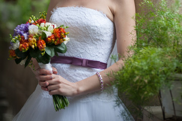 Beautiful bride with bouquet before wedding ceremony