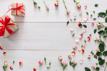 Valentine day background, gift boxes and flowers on white wood