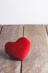 Red Heart Shape pillows on wooden background