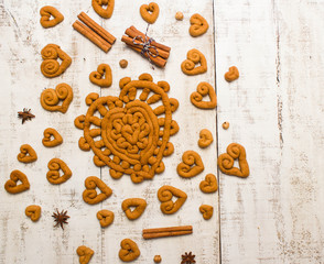 Cookies in the shape of a heart on a white wooden background