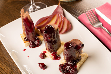 Deer steak with fruit jam and wine