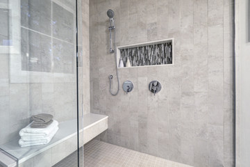 Glass walk-in shower in a bathroom of brand new home - 133612515