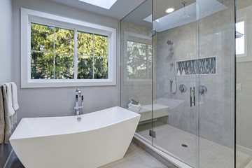 Glass walk-in shower in a bathroom of new luxury home - obrazy, fototapety, plakaty