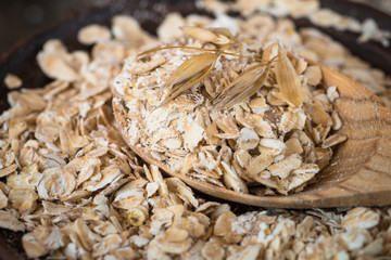 Oat flakes in ceramic bowl.