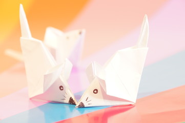 
Paper origami mouse isolated on the colorful background