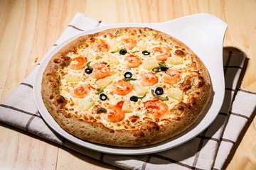 shrimp pizza on plate