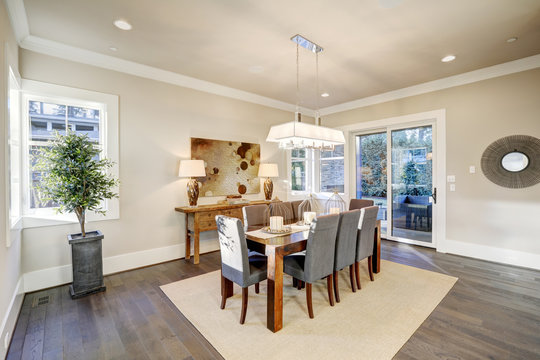 Lovely dining room with rectangular table and grey chairs