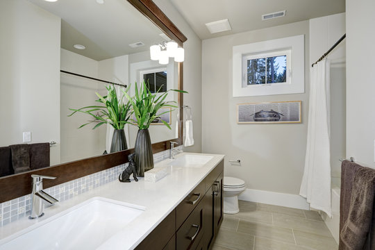 White and brown bathroom design in brand-new home