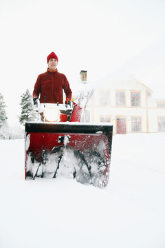 Woman pulling snowplow