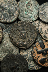 Pile of ancient islamic bronze coins close-up shot