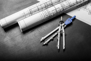 Construction planning drawings on black background