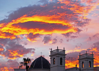 Obraz premium Blue sky background with white clouds. Sunset in the old town